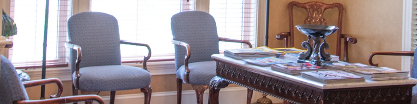 Two female dental team members with masks