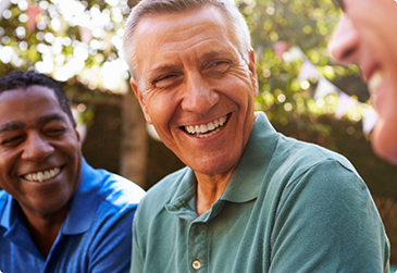Men sitting and laughing outside