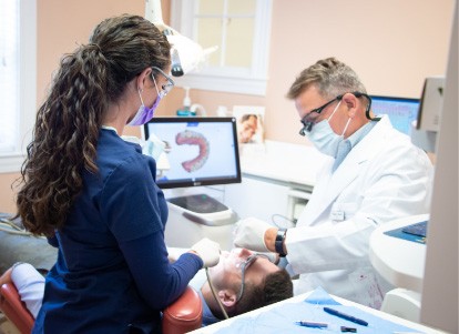 smiling Dr. Bower with a patient