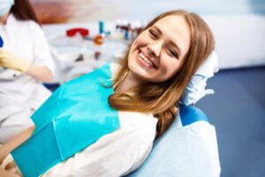 Woman smiling after her teeth cleaning